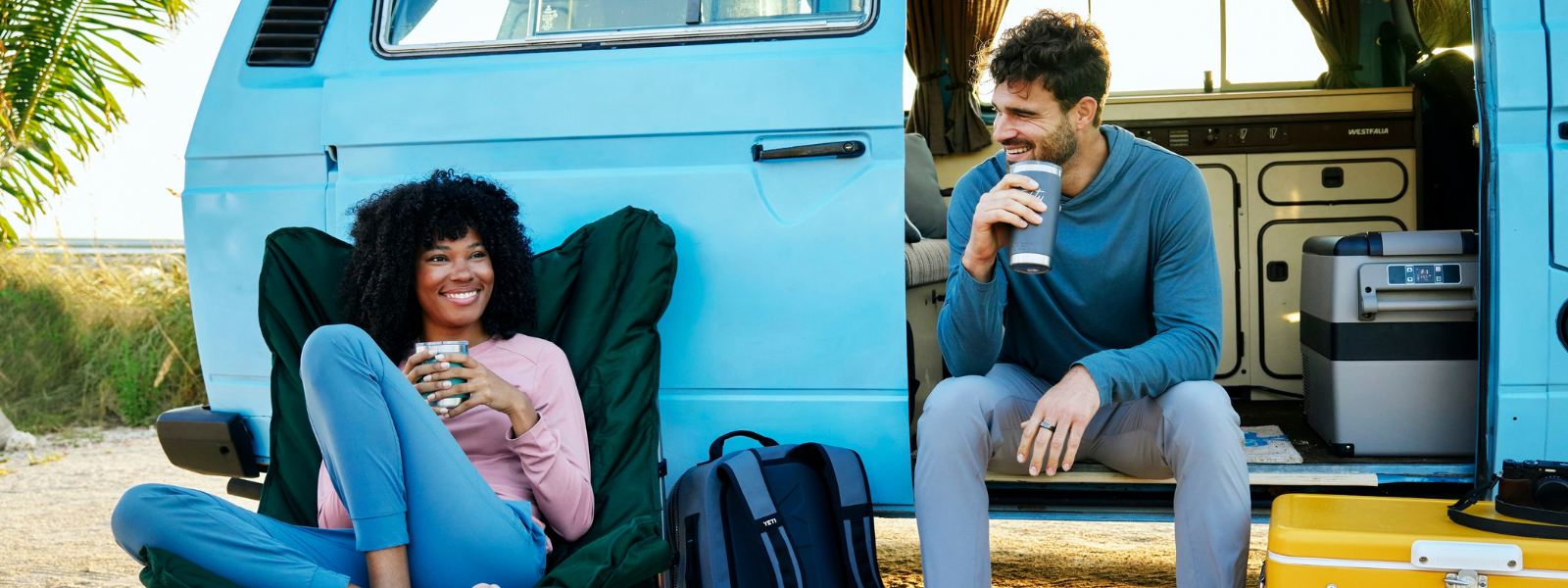 Man and Woman hanging outside of their van talking